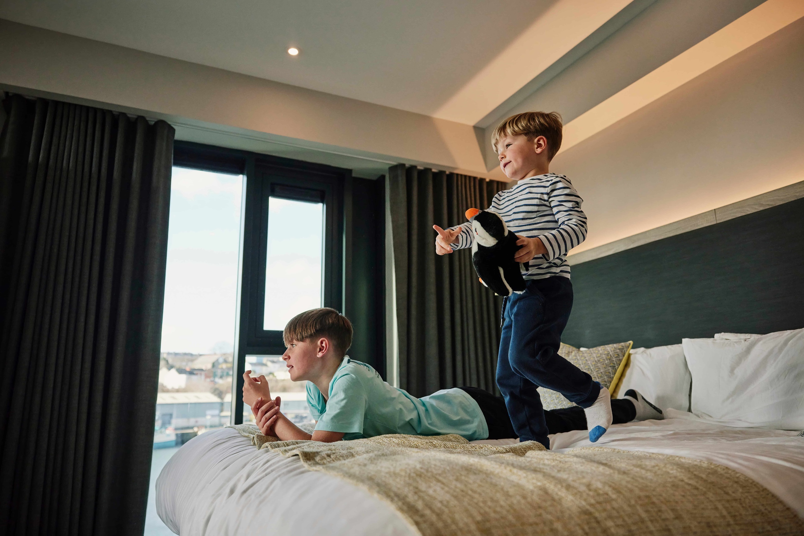 Children jumping on the bed