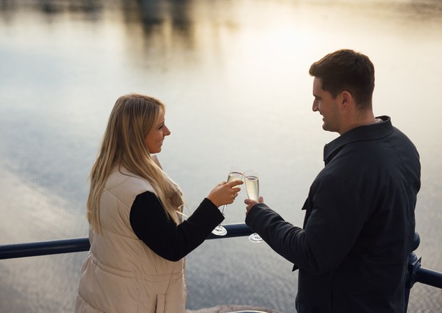 Christmas Couple on the Waterfront with Champagne