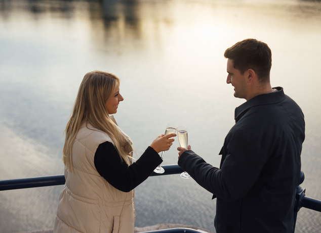 Christmas Couple on the Waterfront with Champagne