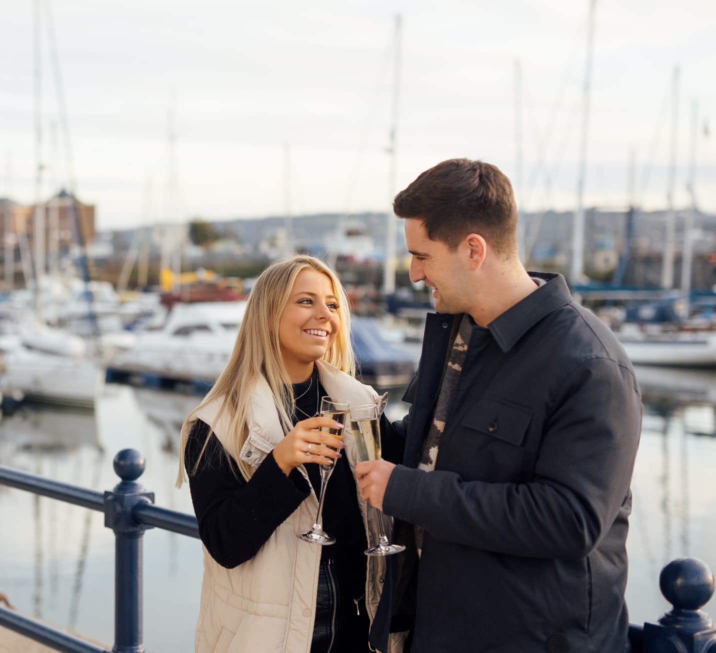 Couple on the Waterfront with Champagne