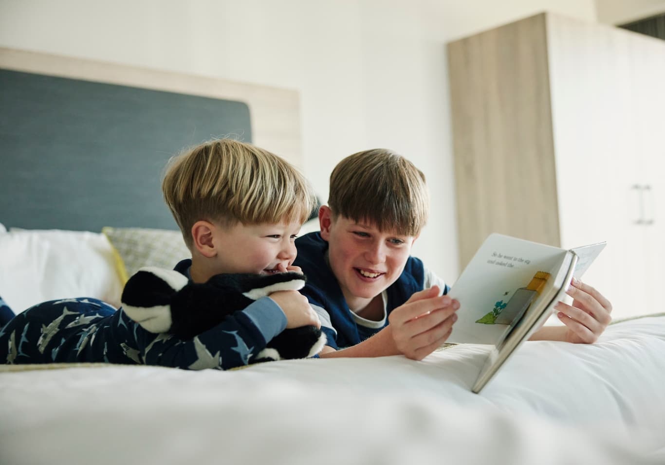 Children Reading in Family Bedroom