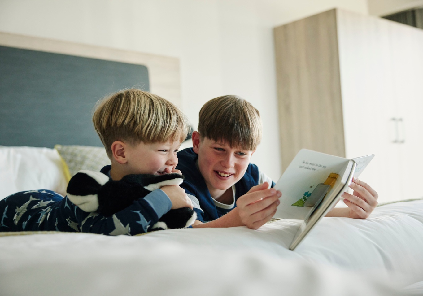 Children Reading in Family Bedroom