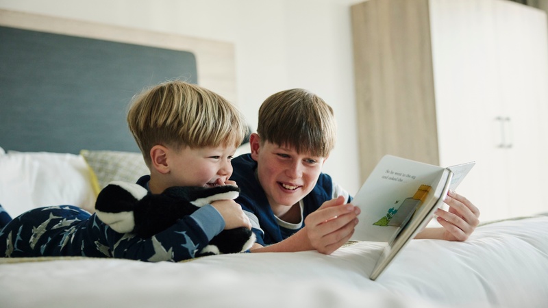 Children Reading in Family Bedroom