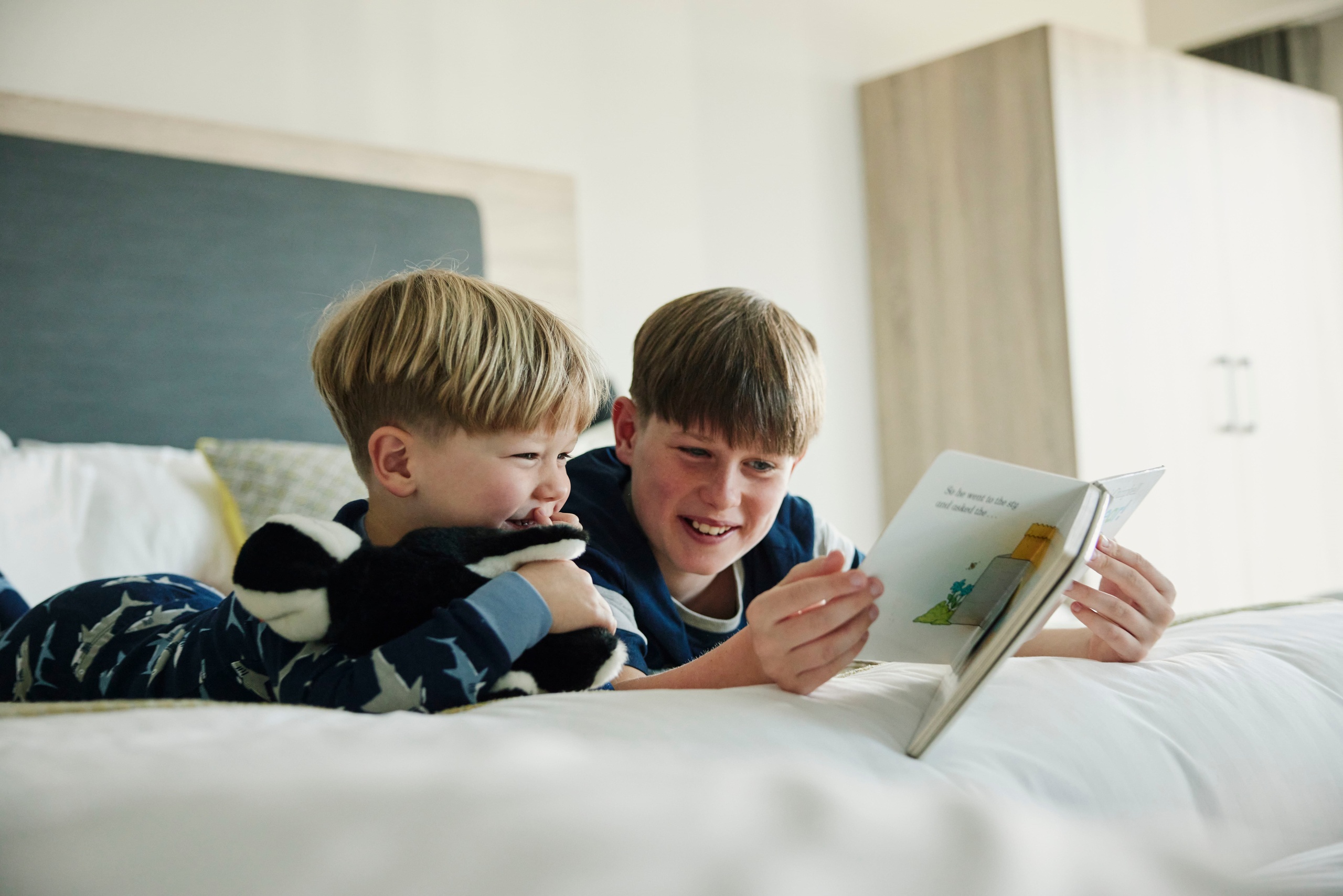 Children Reading in Family Bedroom